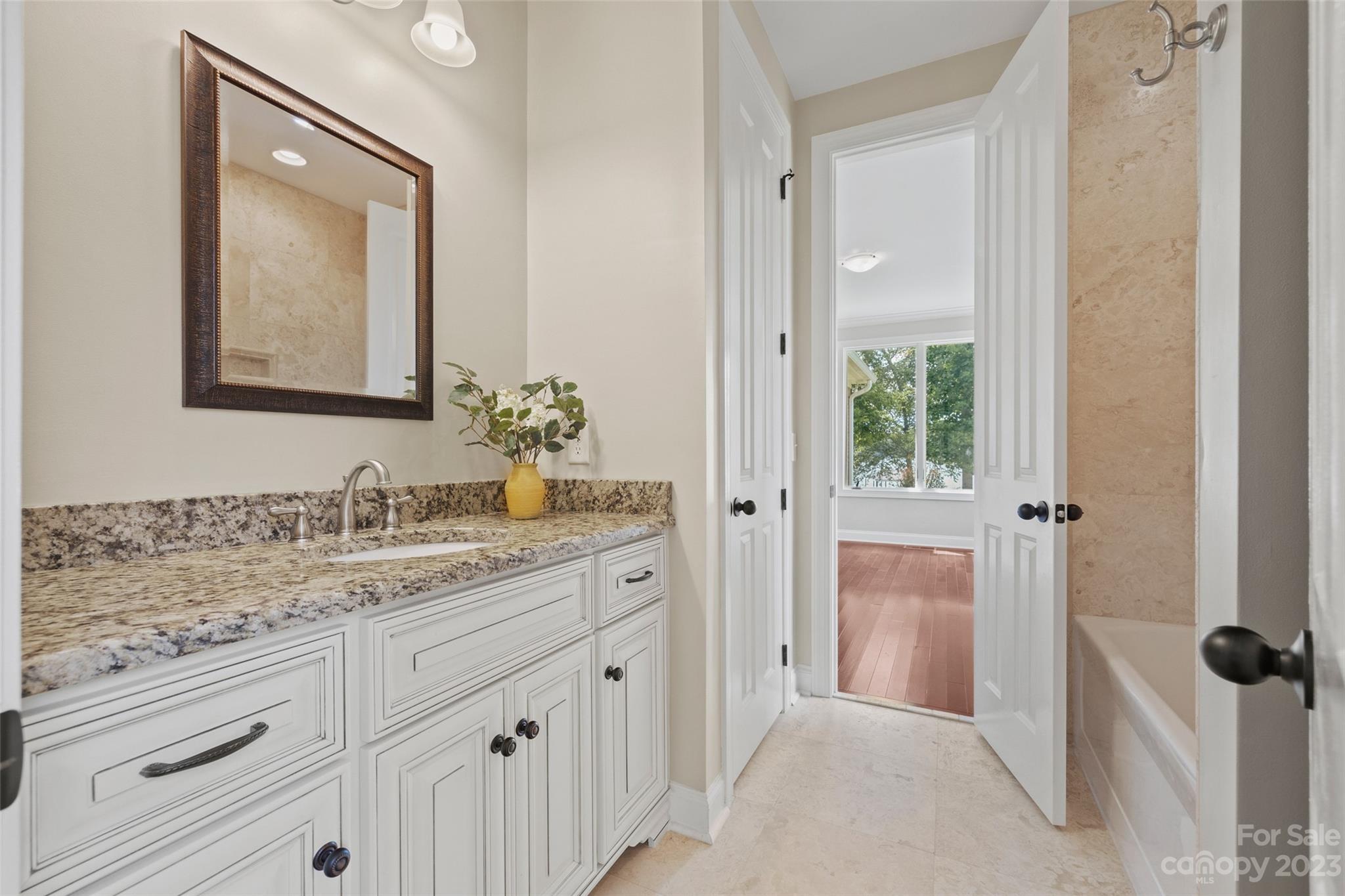10285 Lakeshore Drive Lancaster, SC 29720 - Photo 34 of 48 a bathroom with a sink and a mirror