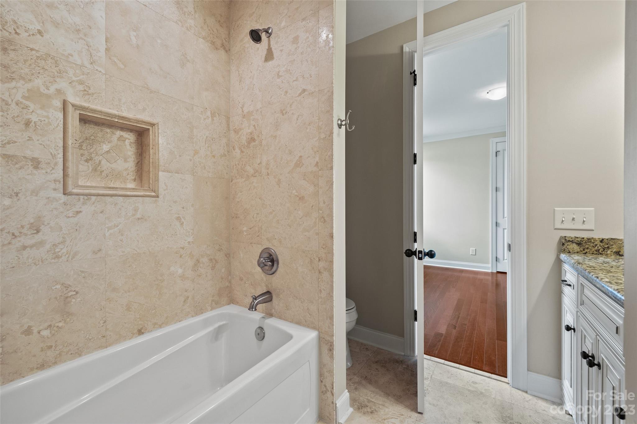 10285 Lakeshore Drive Lancaster, SC 29720 - Photo 35 of 48 a bathroom with a bathtub and a shower
