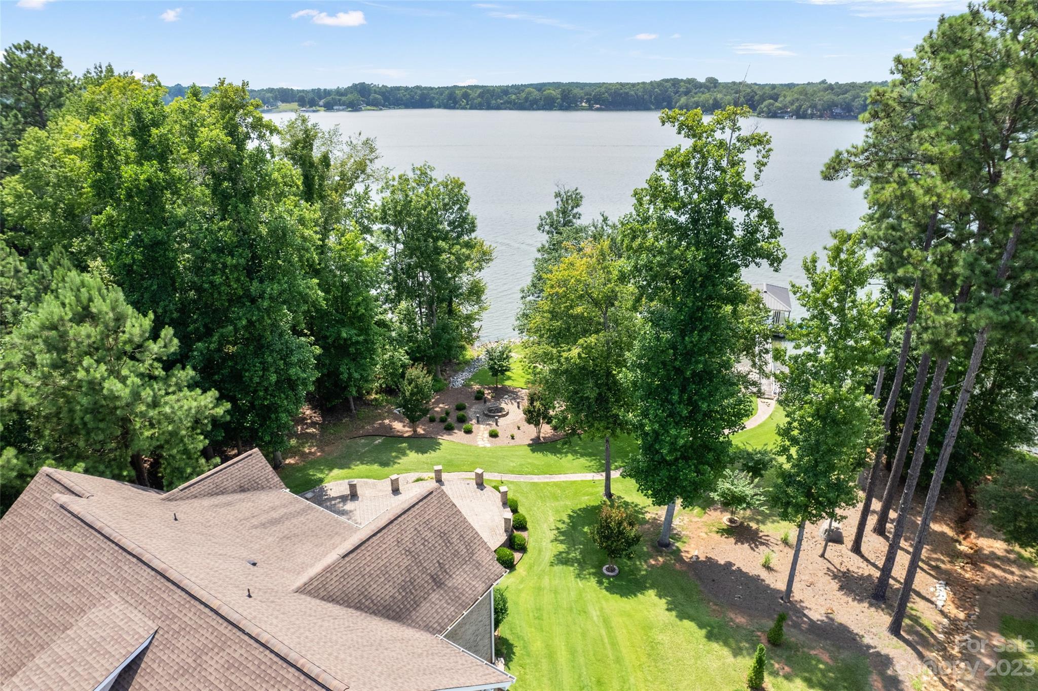 10285 Lakeshore Drive Lancaster, SC 29720 - Photo 40 of 48 a view of a lake with a yard and large trees