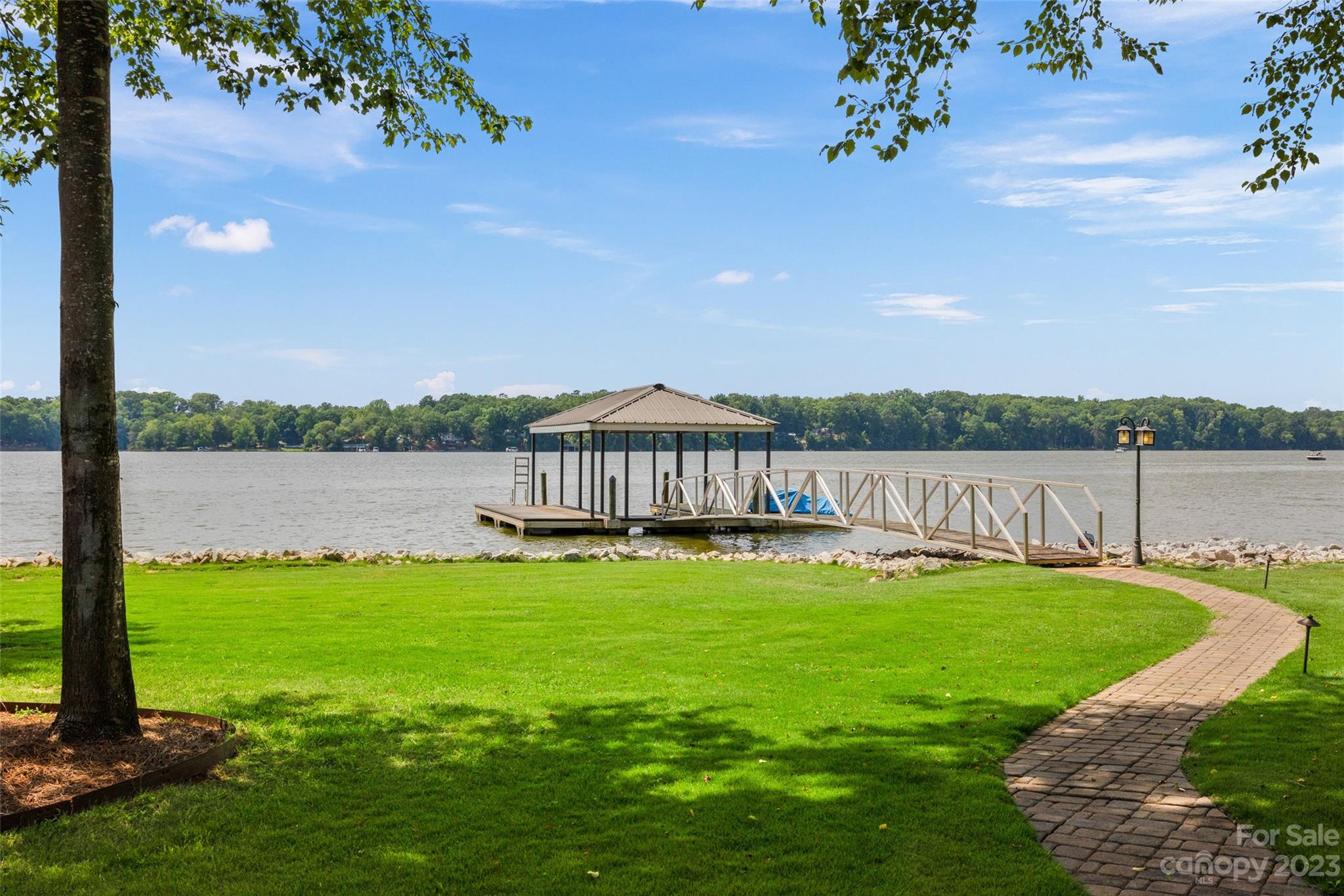 10285 Lakeshore Drive Lancaster, SC 29720 - Photo 10 of 48 a view of a lake with a garden
