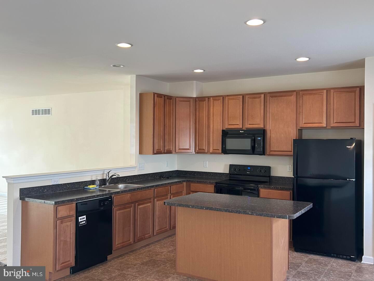 475 Toftrees Drive Middletown, DE 19709 - Photo 6 of 11 a kitchen with a refrigerator and a stove top oven