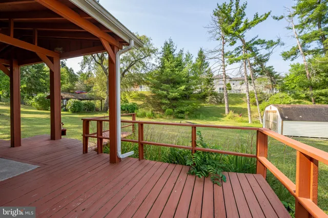 a view of a deck with wooden floor and outdoor space