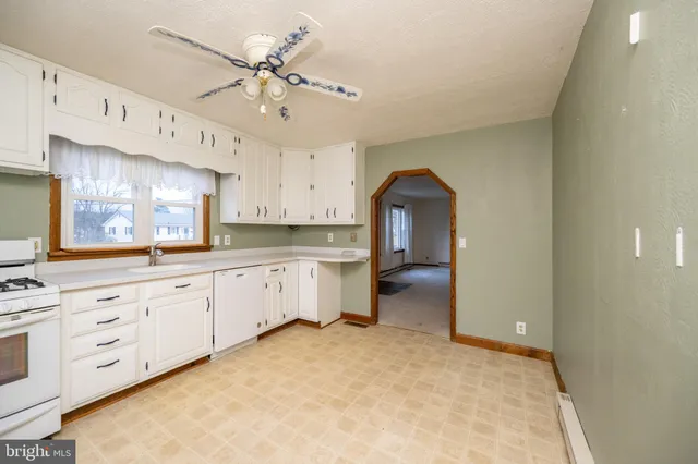 a kitchen with a sink and cabinets