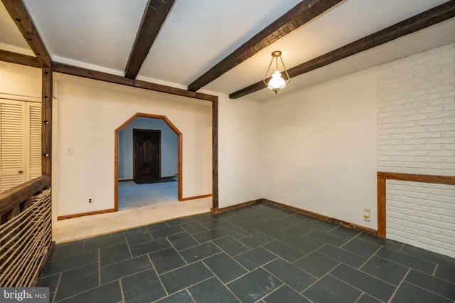 a bathroom with a sink a toilet and shower curtain