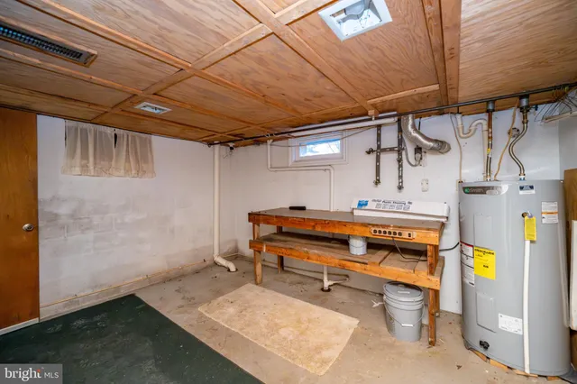 a kitchen with cabinets a sink and white stainless steel appliances