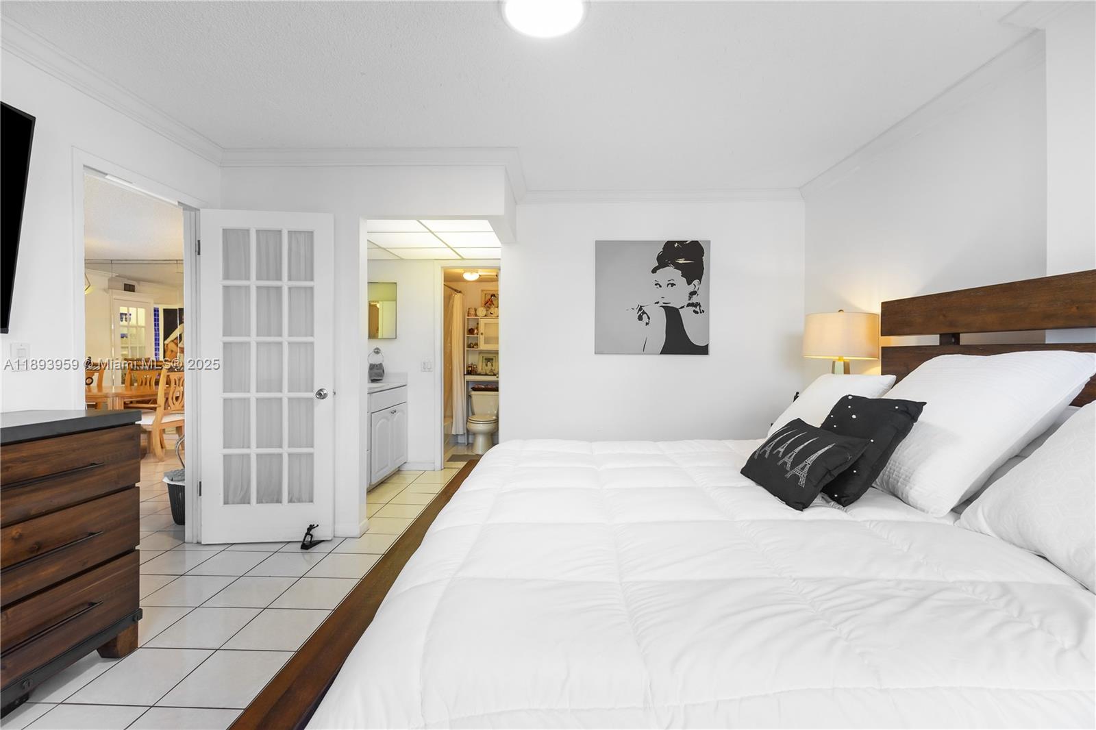 77 Crandon Boulevard, Unit 3C Key Biscayne, FL 33149 - Photo 18 of 34 a bedroom with a bed and walk in closet