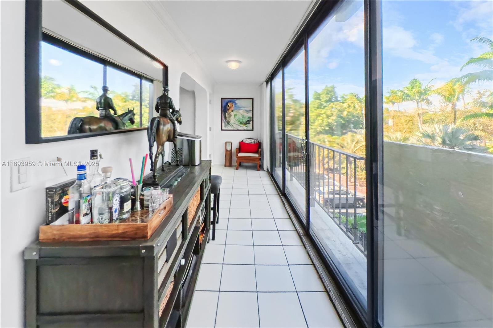 77 Crandon Boulevard, Unit 3C Key Biscayne, FL 33149 - Photo 28 of 34 a view of an chairs and tables in balcony