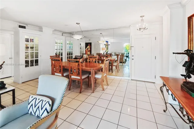 a living room with furniture and kitchen view