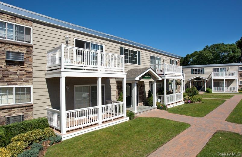 110 Magaw Place, Unit A15 West Babylon, NY 11704 - Photo 1 of 2 a view of a house with a yard