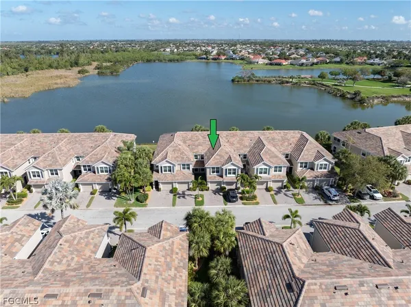 an aerial view of a house with a lake view