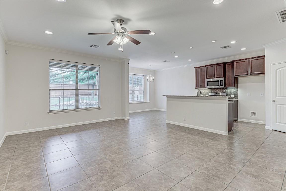 14001 Avery Ranch Boulevard, Unit 103 Austin, TX 78717 - Photo 2 of 29 a view of a kitchen with microwave and cabinets