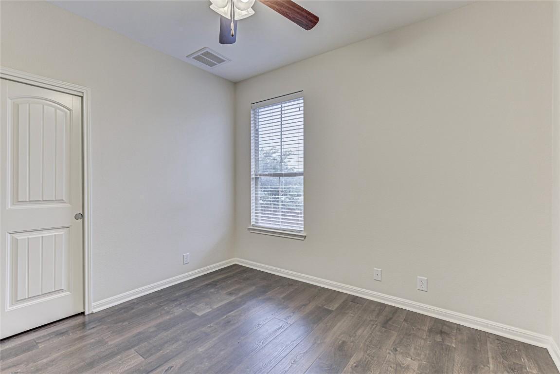 14001 Avery Ranch Boulevard, Unit 103 Austin, TX 78717 - Photo 22 of 29 wooden floor in an empty room with a window