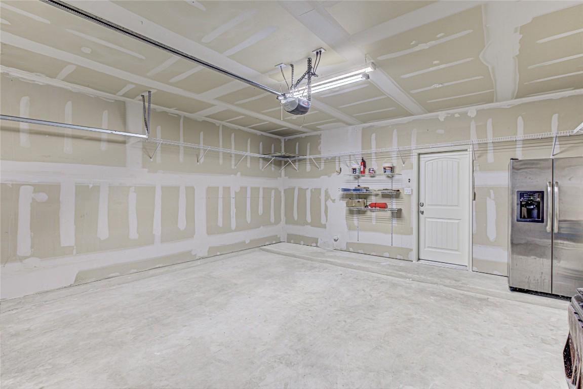 14001 Avery Ranch Boulevard, Unit 103 Austin, TX 78717 - Photo 26 of 29 a view of a garage