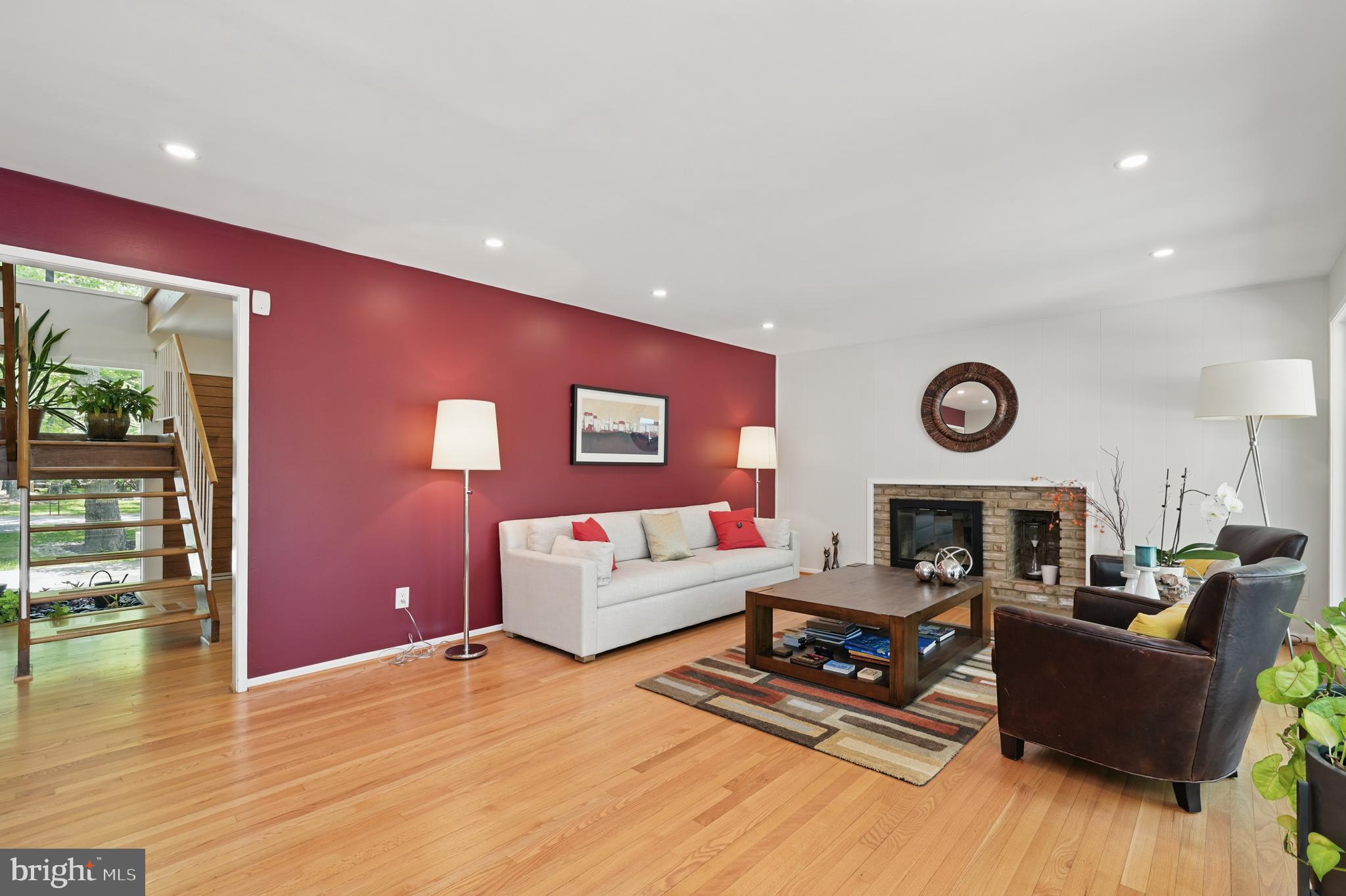 8024 Fenway Road Bethesda, MD 20817 - Photo 13 of 64 a living room with furniture and a fireplace