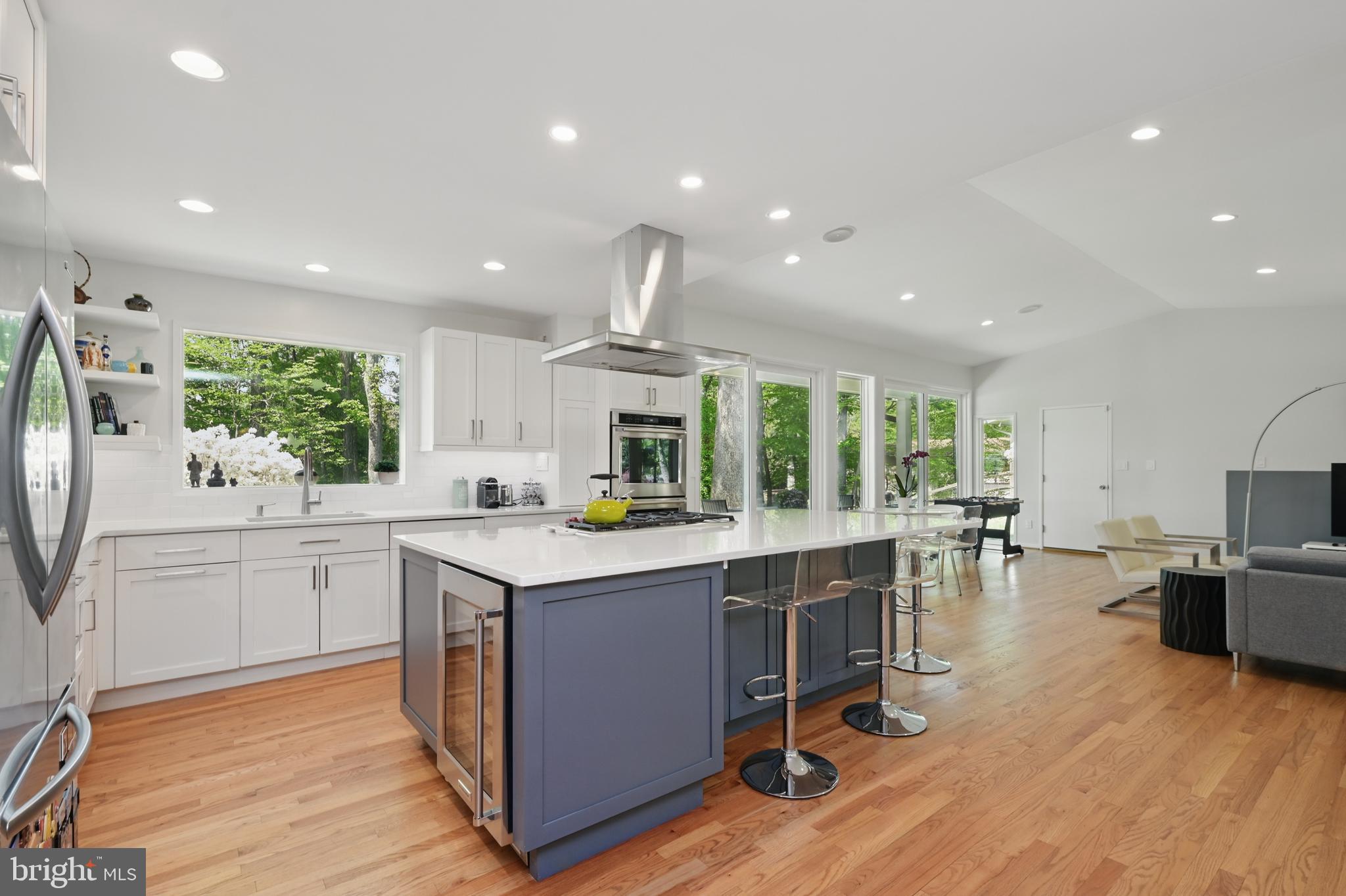 8024 Fenway Road Bethesda, MD 20817 - Photo 17 of 64 a kitchen with sink cabinets and wooden floor