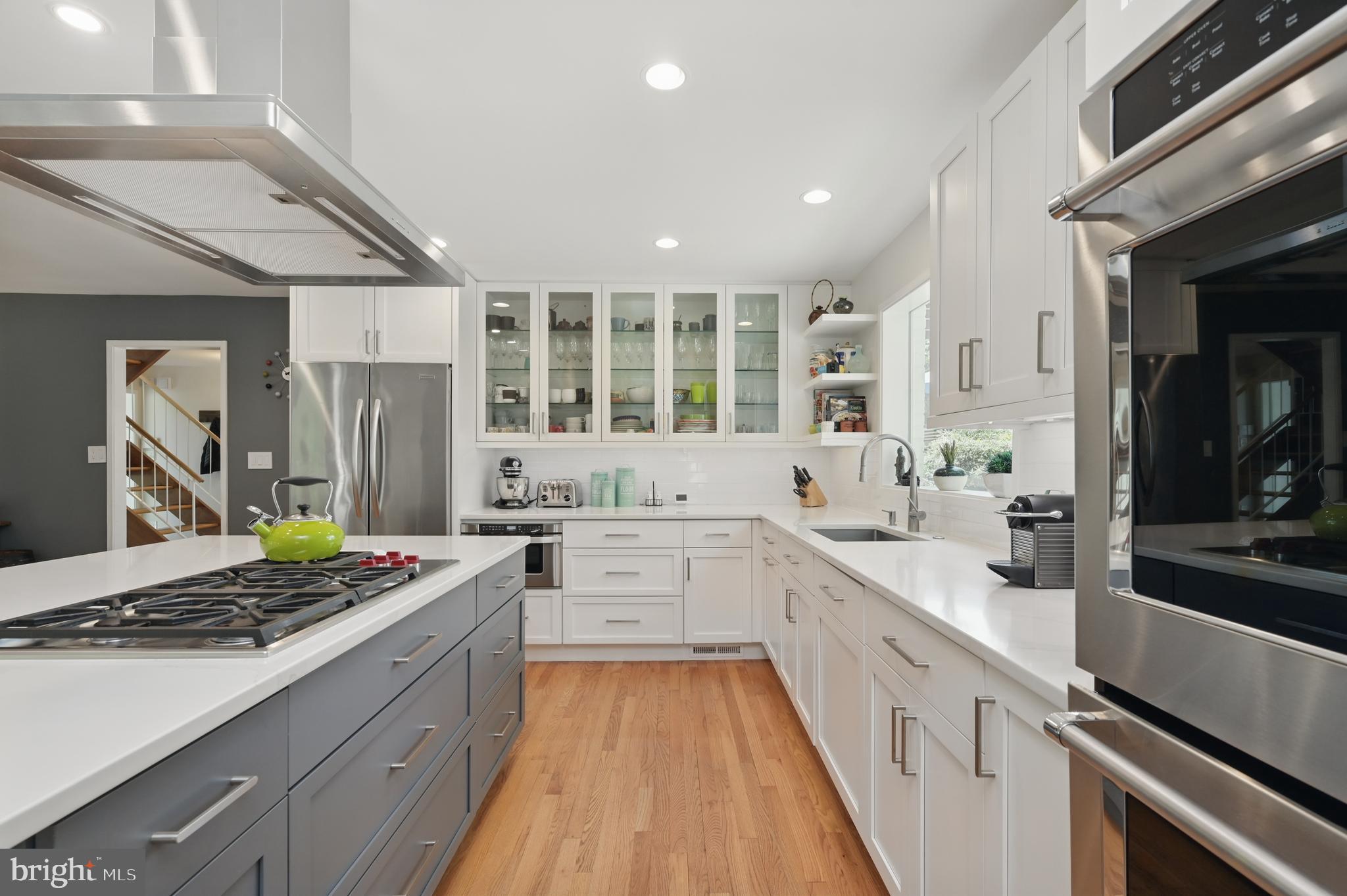 8024 Fenway Road Bethesda, MD 20817 - Photo 19 of 64 a large kitchen with stainless steel appliances granite countertop a lot of counter space and a stove