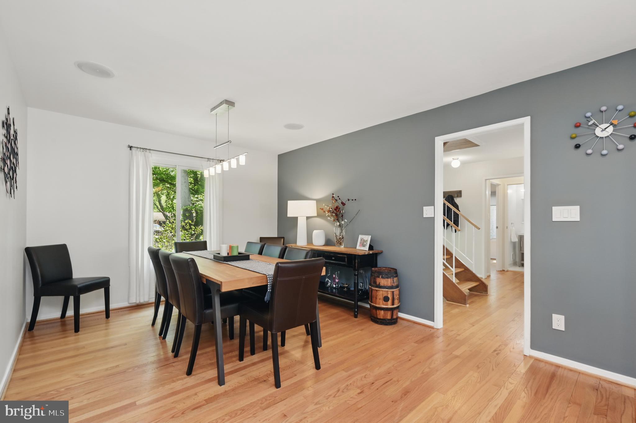 8024 Fenway Road Bethesda, MD 20817 - Photo 21 of 64 a view of a dining room with furniture and wooden floor