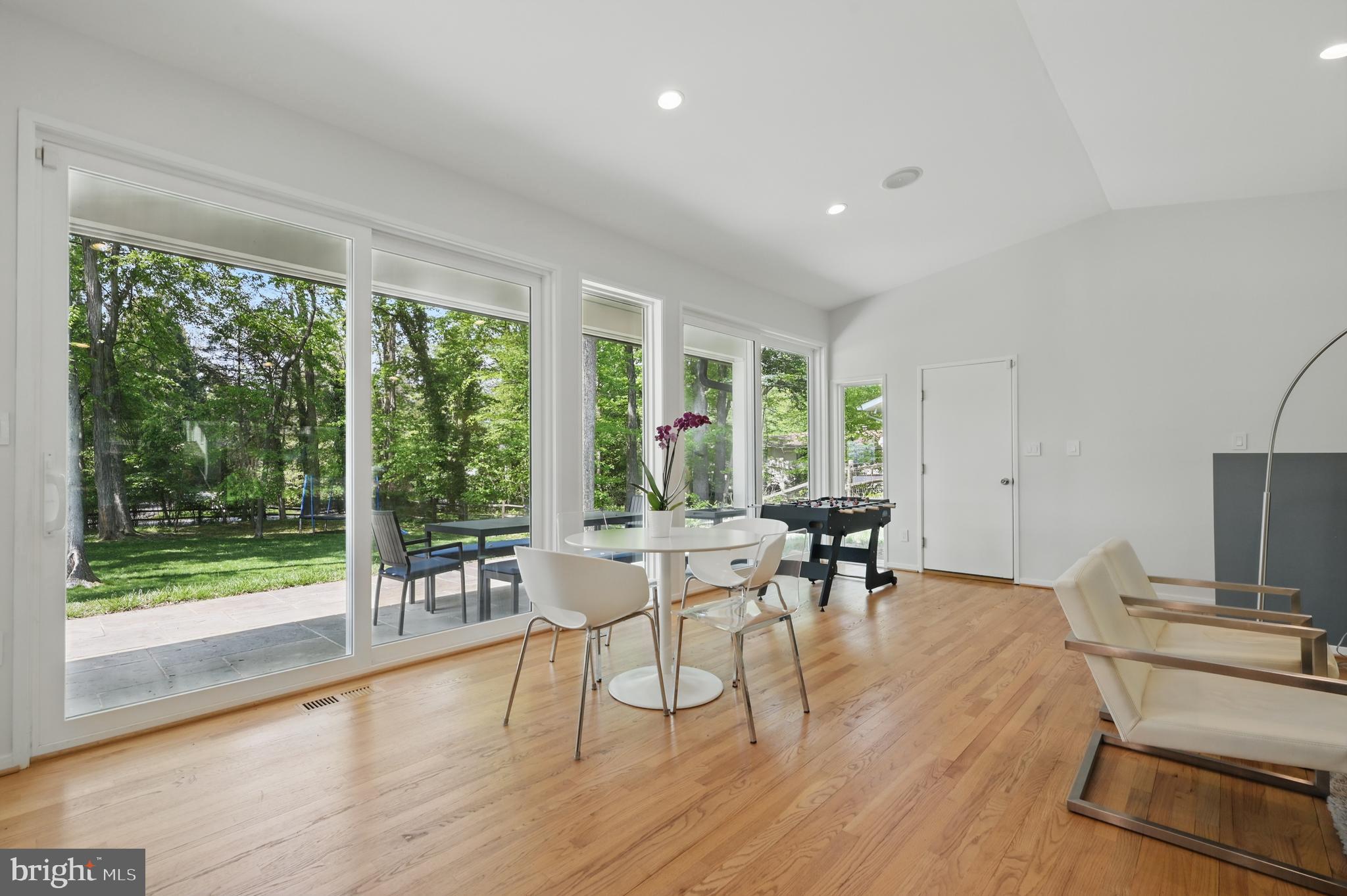8024 Fenway Road Bethesda, MD 20817 - Photo 30 of 64 a view of a dining room with furniture and wooden floor