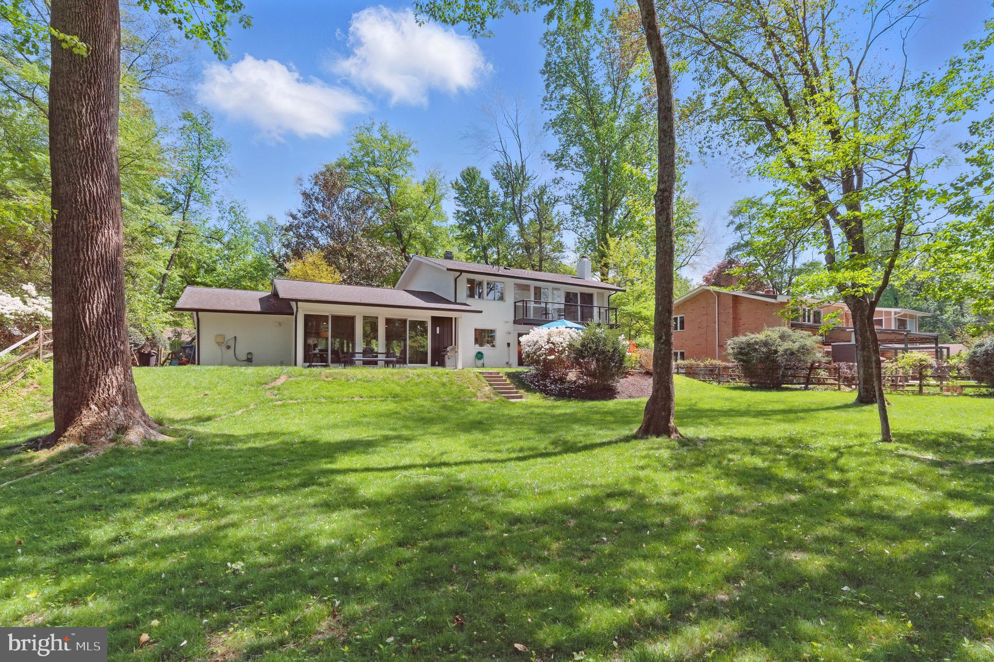 8024 Fenway Road Bethesda, MD 20817 - Photo 3 of 64 a front view of house with a garden and trees