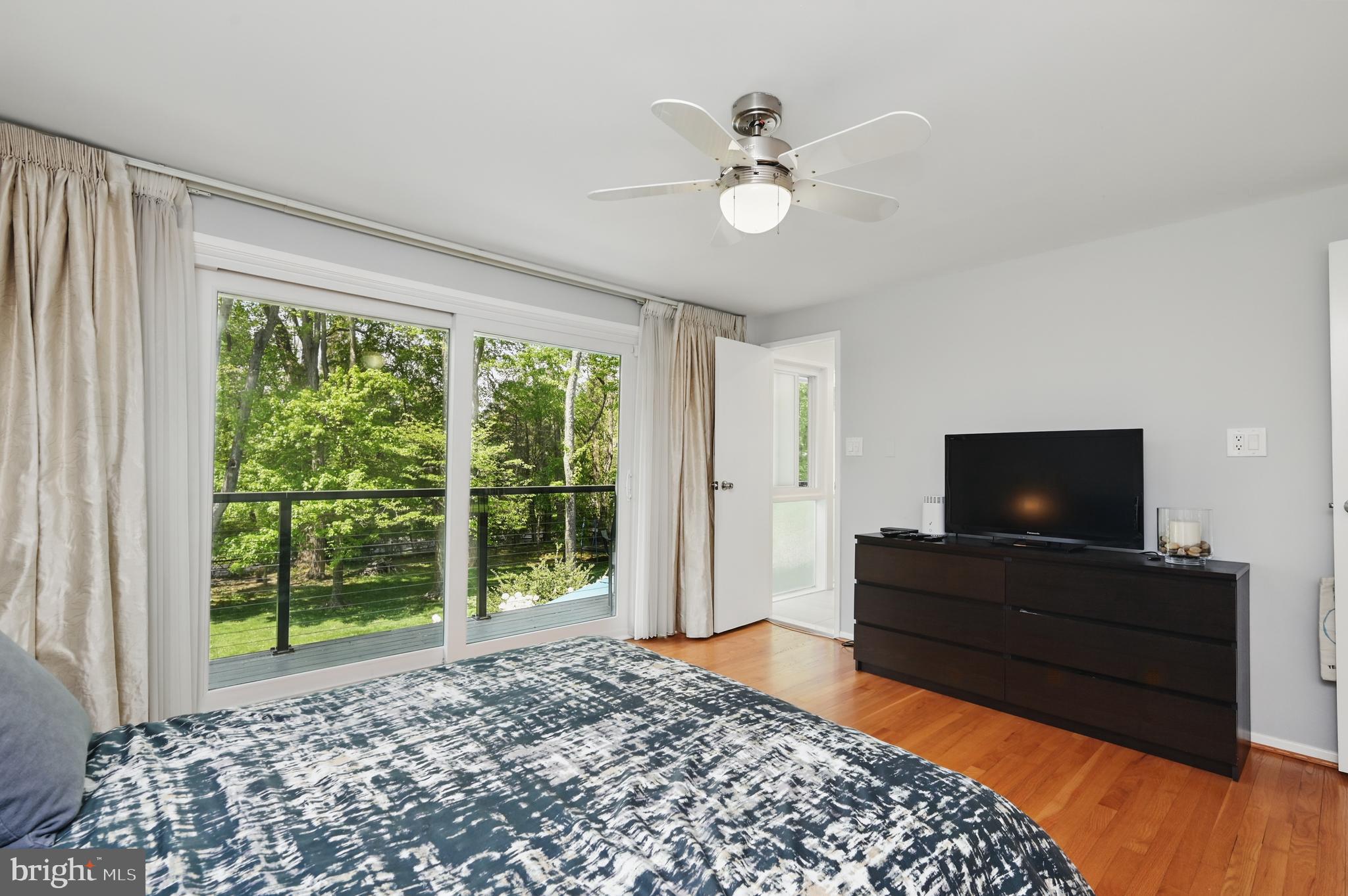 8024 Fenway Road Bethesda, MD 20817 - Photo 39 of 64 a living room with a flat screen tv and a large window