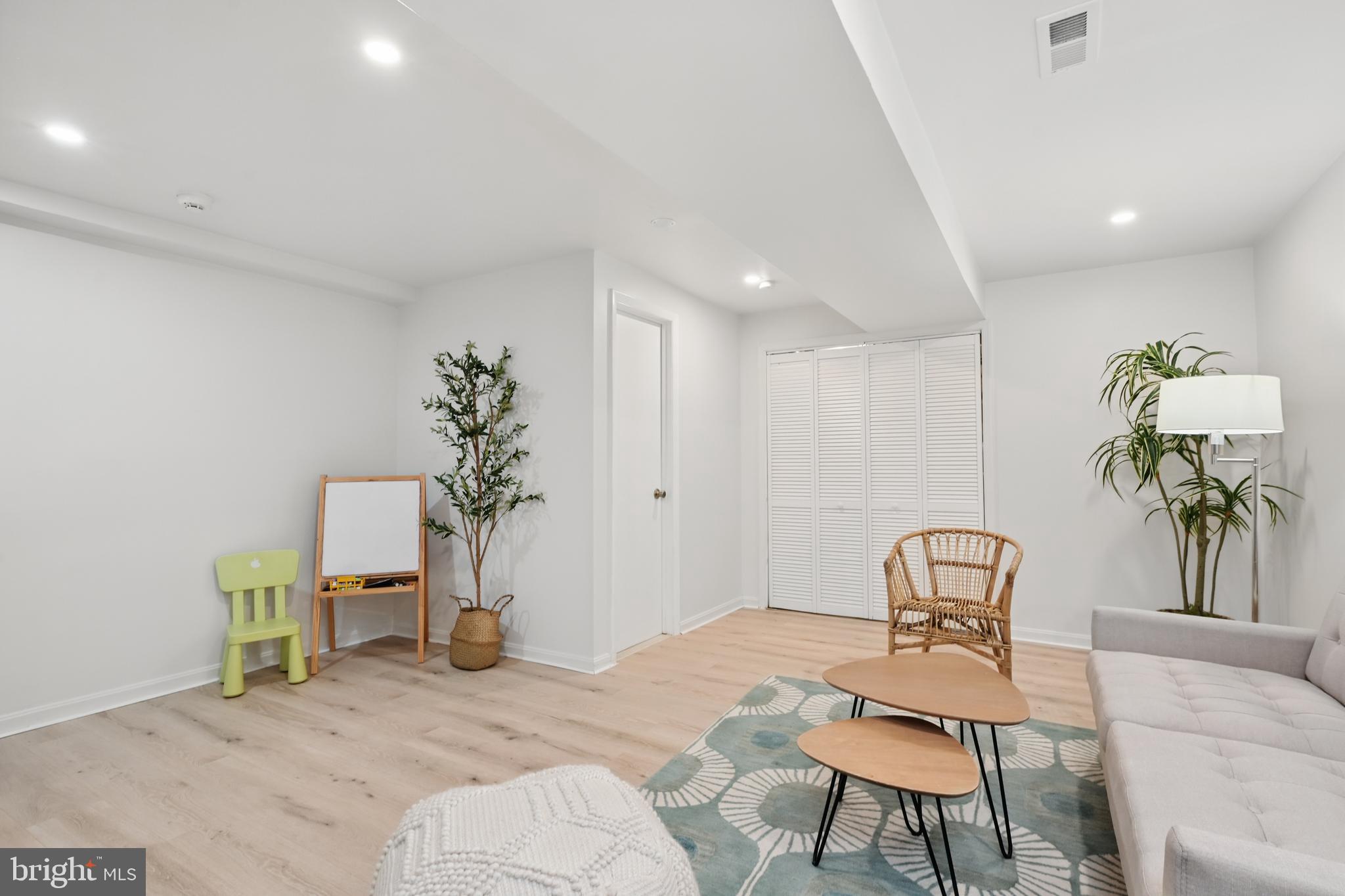 8024 Fenway Road Bethesda, MD 20817 - Photo 51 of 64 a living room with furniture and a potted plant