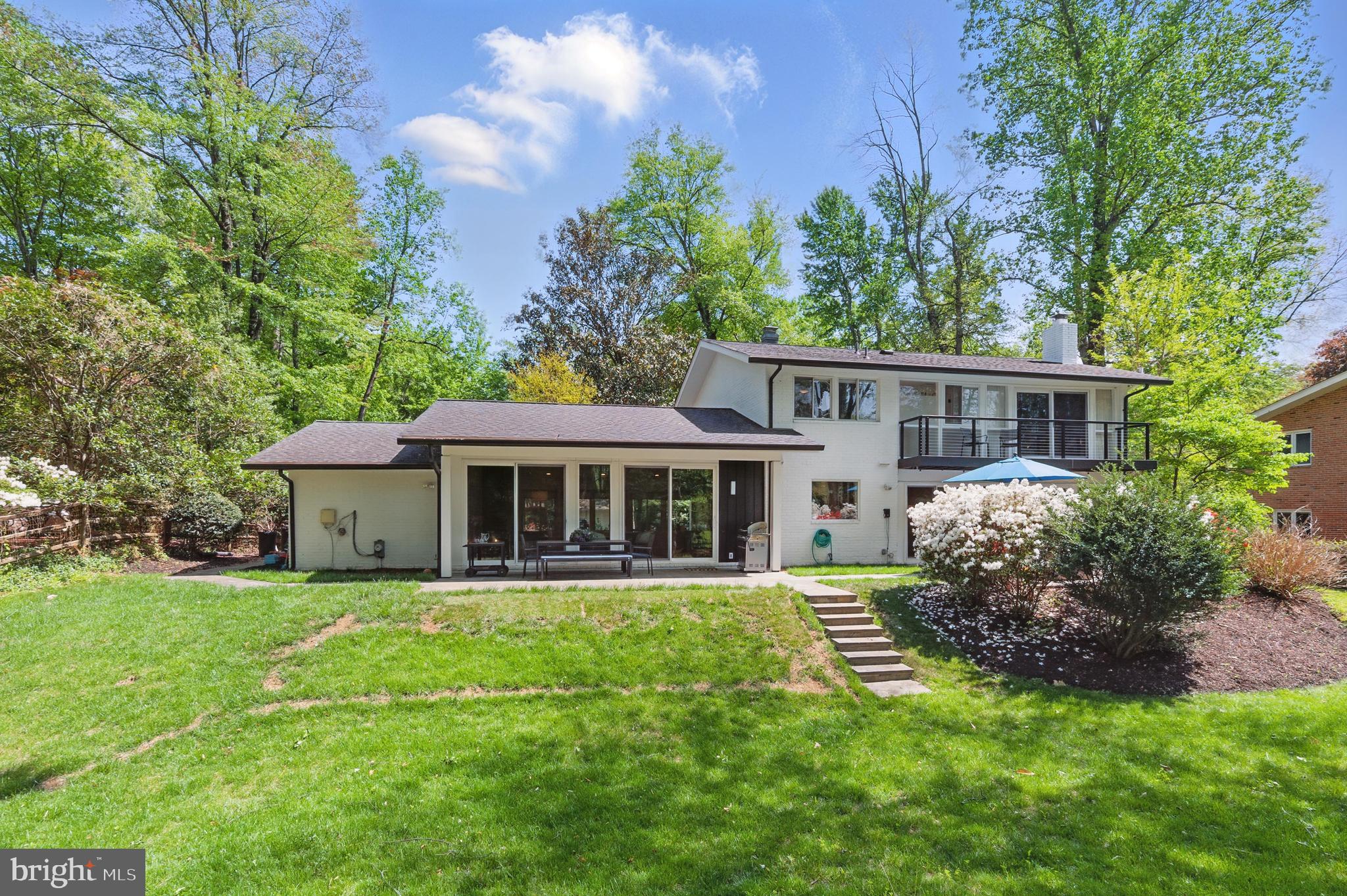 8024 Fenway Road Bethesda, MD 20817 - Photo 59 of 64 a view of a house with a yard and potted plants