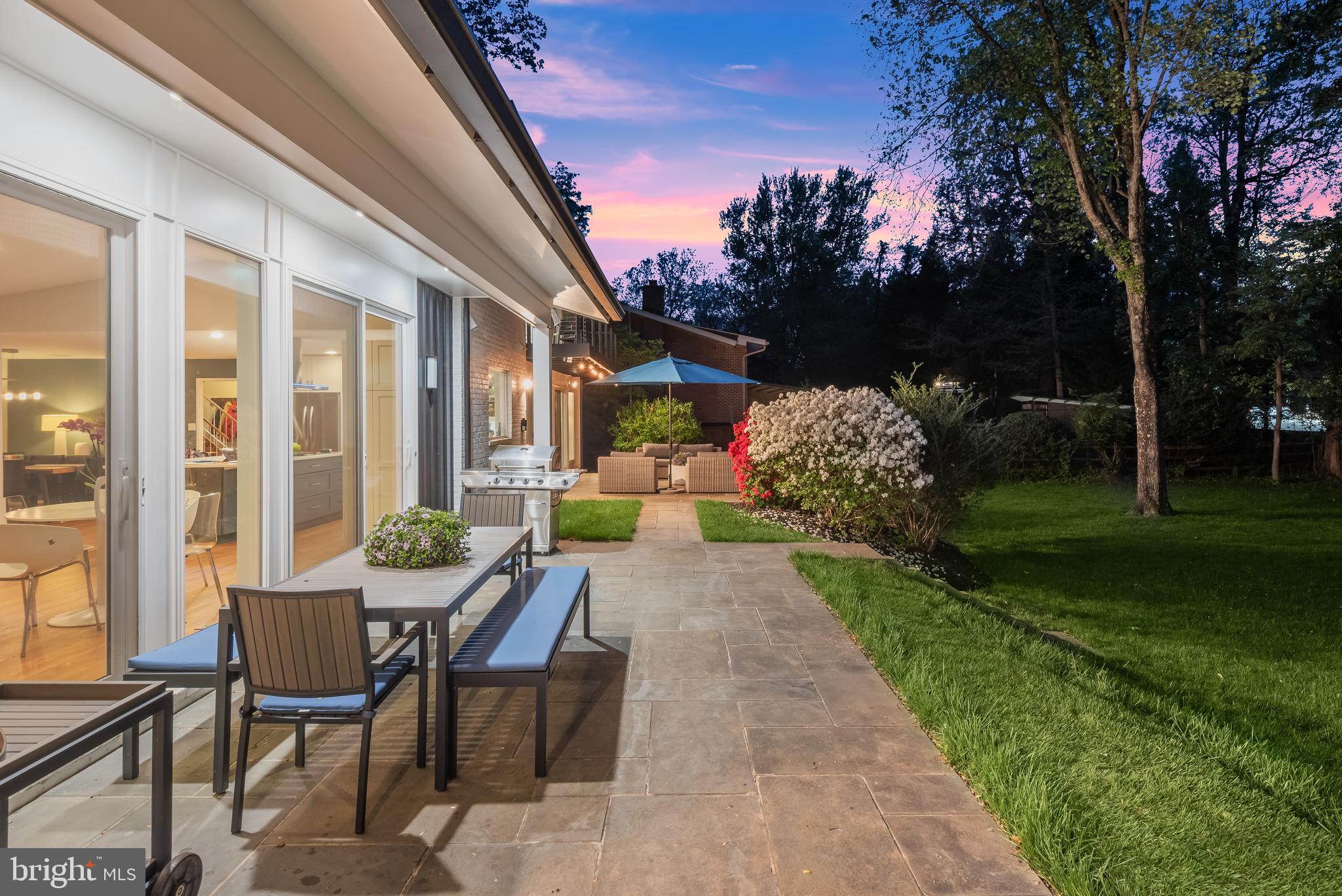8024 Fenway Road Bethesda, MD 20817 - Photo 6 of 64 a view of patio with a table and chairs and potted plants