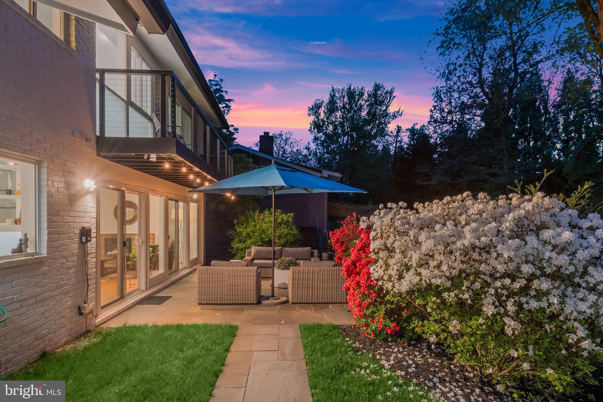 8024 Fenway Road Bethesda, MD 20817 - Photo 7 of 64 a front view of a house with a yard table and chairs