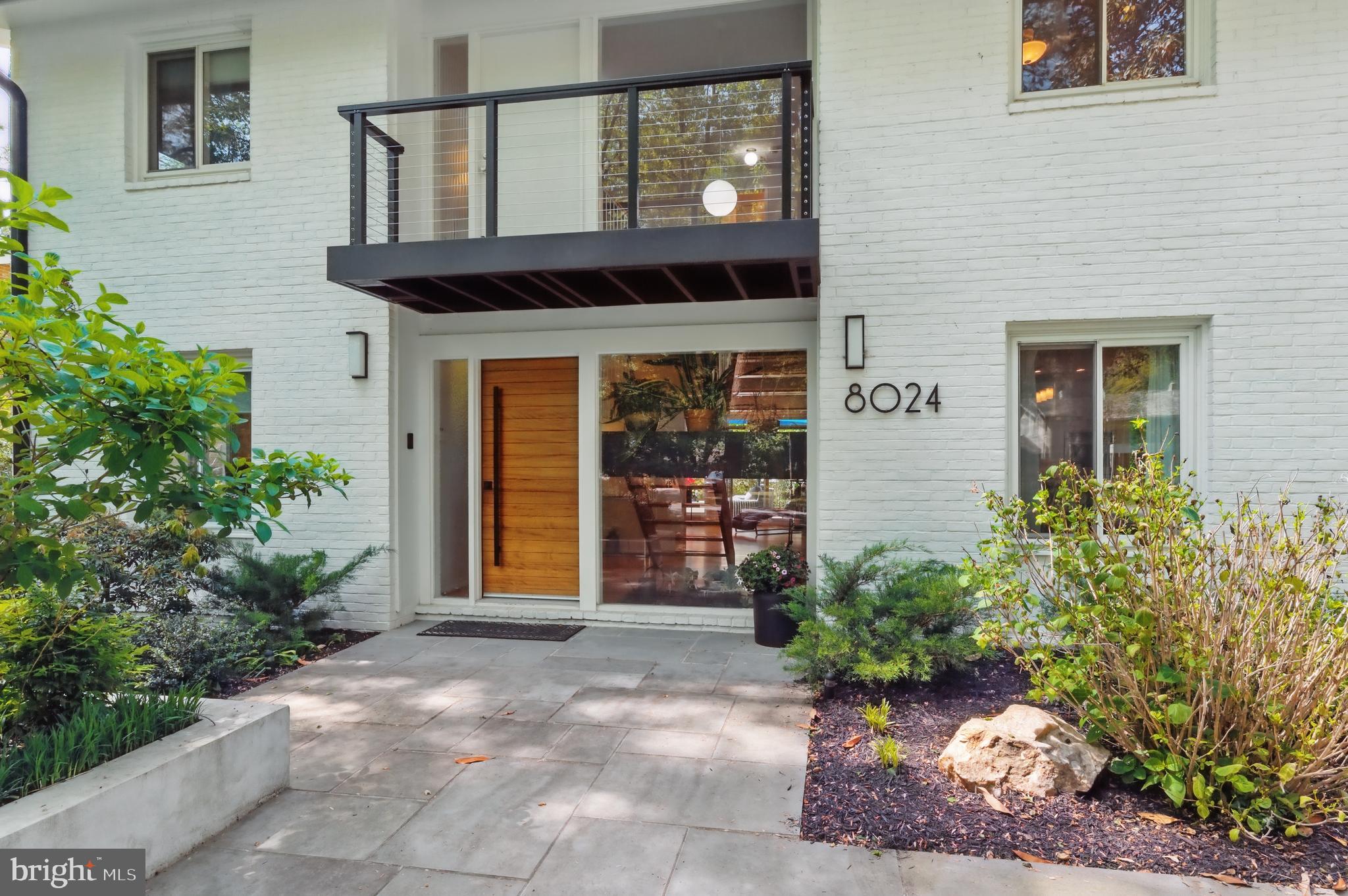 8024 Fenway Road Bethesda, MD 20817 - Photo 8 of 64 a front view of a house with a garden