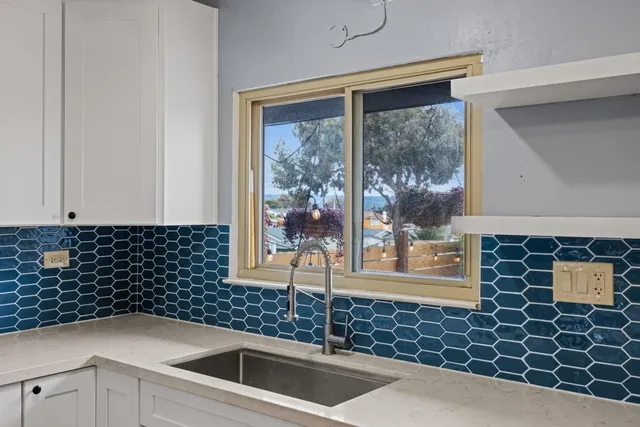 a kitchen with a sink and a window