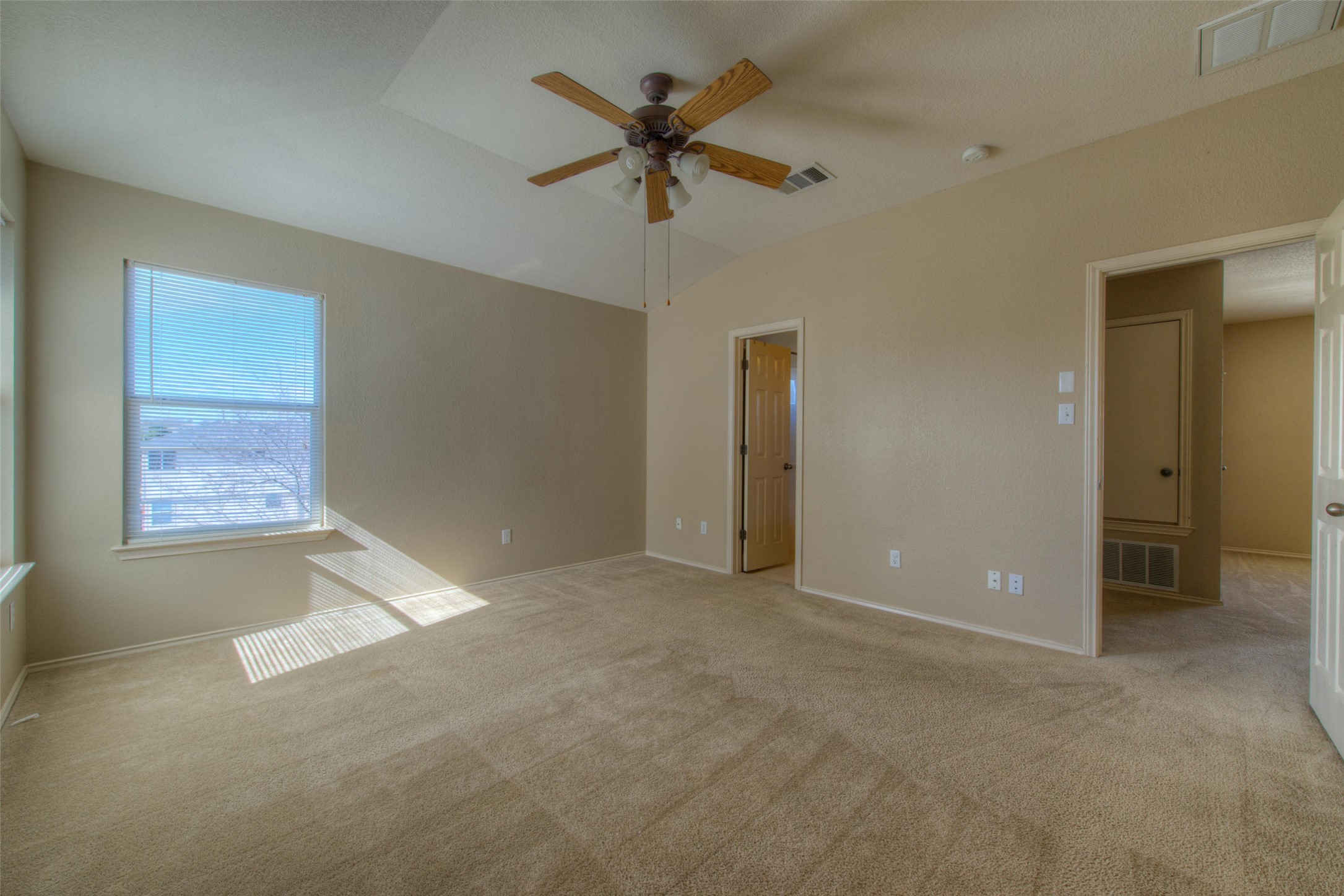 1148 Sundrop Place Round Rock, TX 78665 - Photo 12 of 19 an empty room with fan and windows