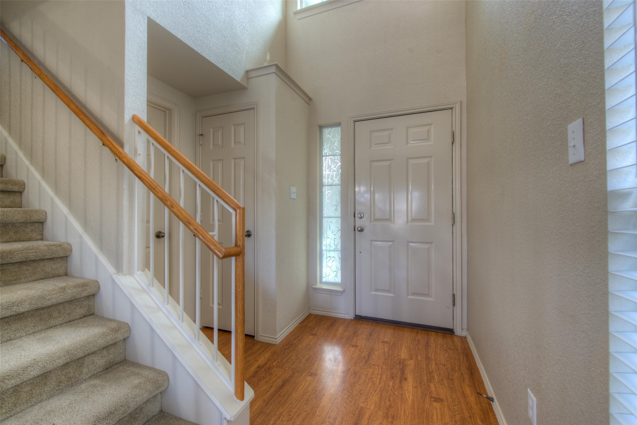 1148 Sundrop Place Round Rock, TX 78665 - Photo 3 of 19 a view of a hallway with wooden floor and entryway
