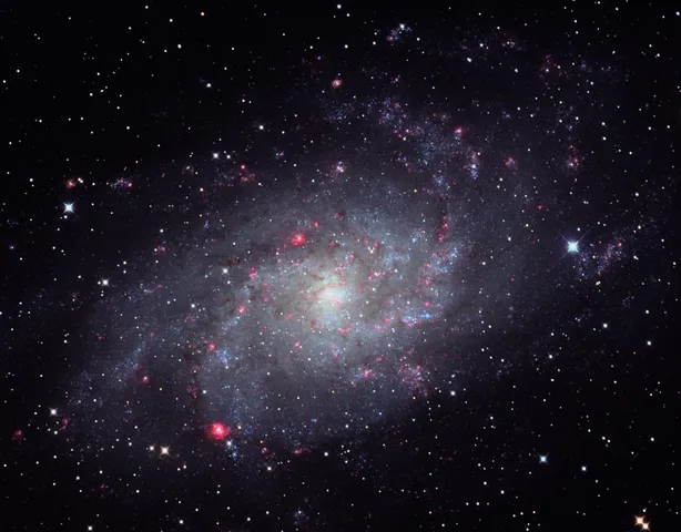 a view of a white house with a yard