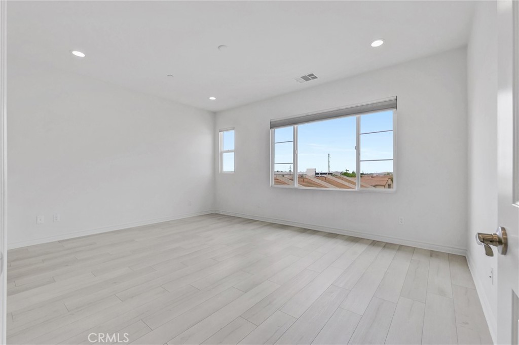 1245 Oliva Court Duarte, CA 91010 - Photo 14 of 23 wooden floor in an empty room with a window