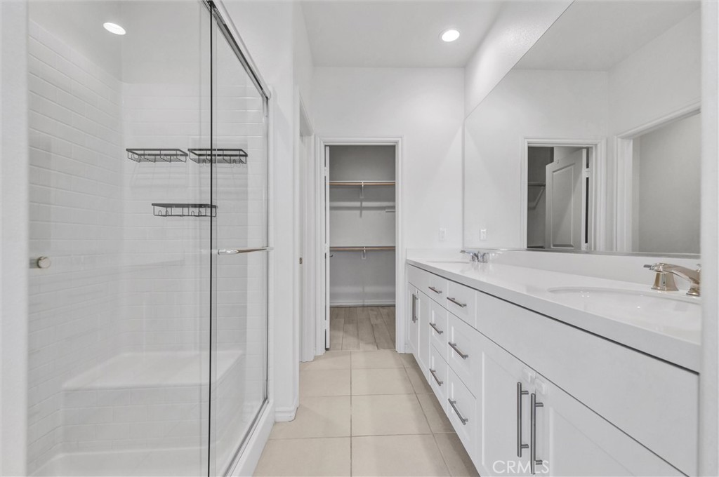 1245 Oliva Court Duarte, CA 91010 - Photo 16 of 23 a bathroom with a double vanity sink and a mirror