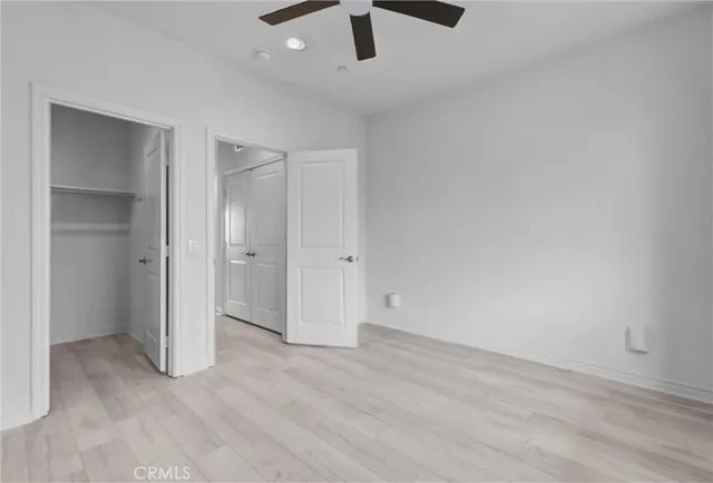 a view of a building with car parked