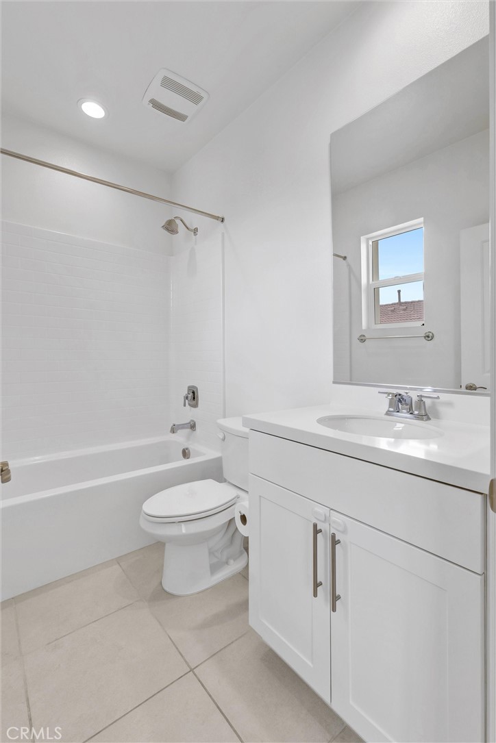 1245 Oliva Court Duarte, CA 91010 - Photo 20 of 23 a bathroom with a toilet a sink a mirror and a bathtub