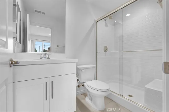 a view of kitchen with refrigerator and window
