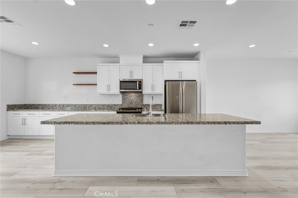 1245 Oliva Court Duarte, CA 91010 - Photo 8 of 23 a large kitchen with stainless steel appliances granite countertop a granite counter tops and a counter top space