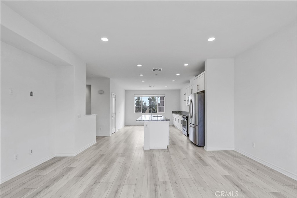 1245 Oliva Court Duarte, CA 91010 - Photo 10 of 23 a view of a kitchen with a sink and wooden floor