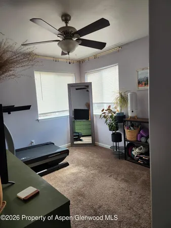 a living room with furniture a window and a fireplace