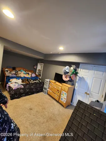 a bedroom with furniture and a bed