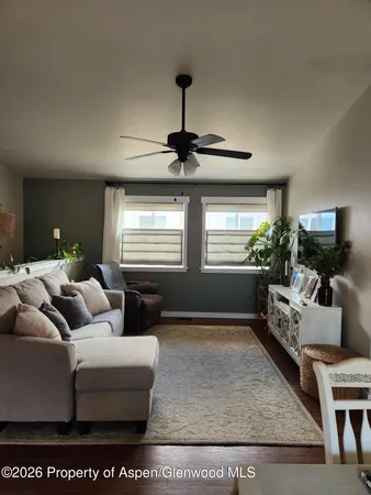a living room with furniture and a window