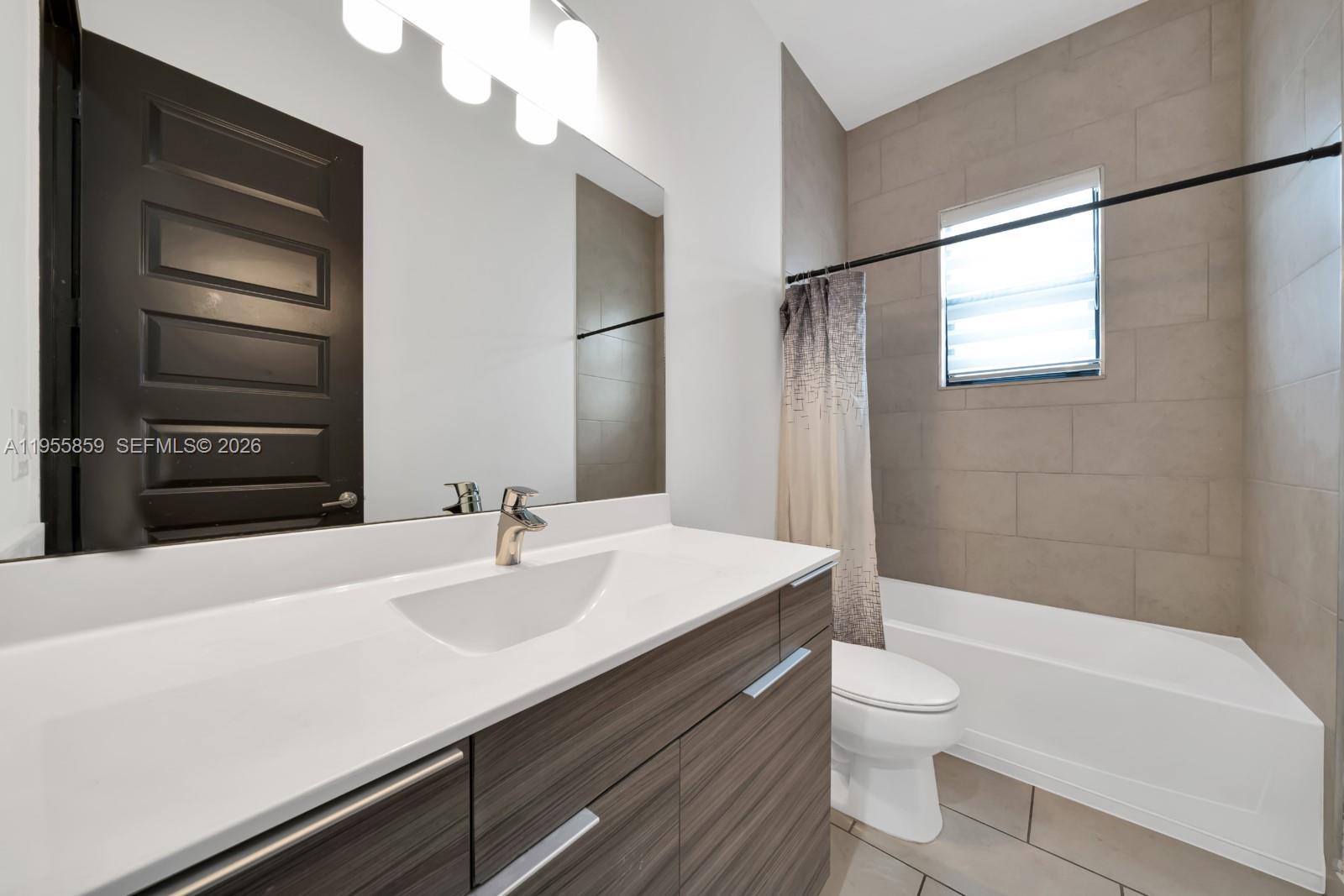 15877 Southwest 136 Way Miami, FL 33196 - Photo 18 of 18 a bathroom with a sink a toilet and shower