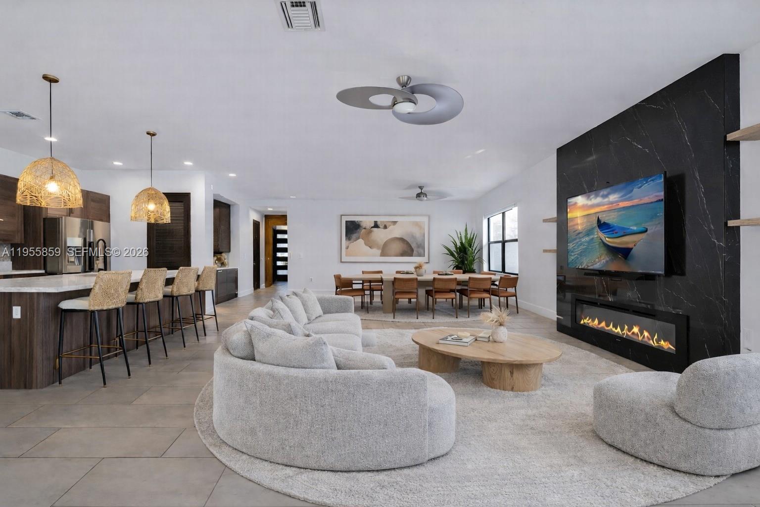 15877 Southwest 136 Way Miami, FL 33196 - Photo 5 of 18 a living room with furniture and a flat screen tv