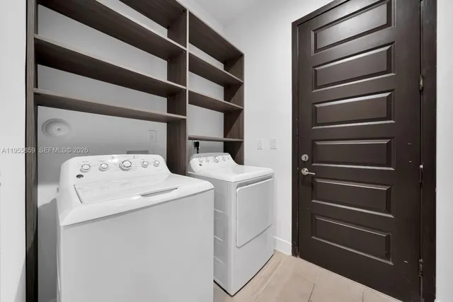 a utility room with dryer and washer