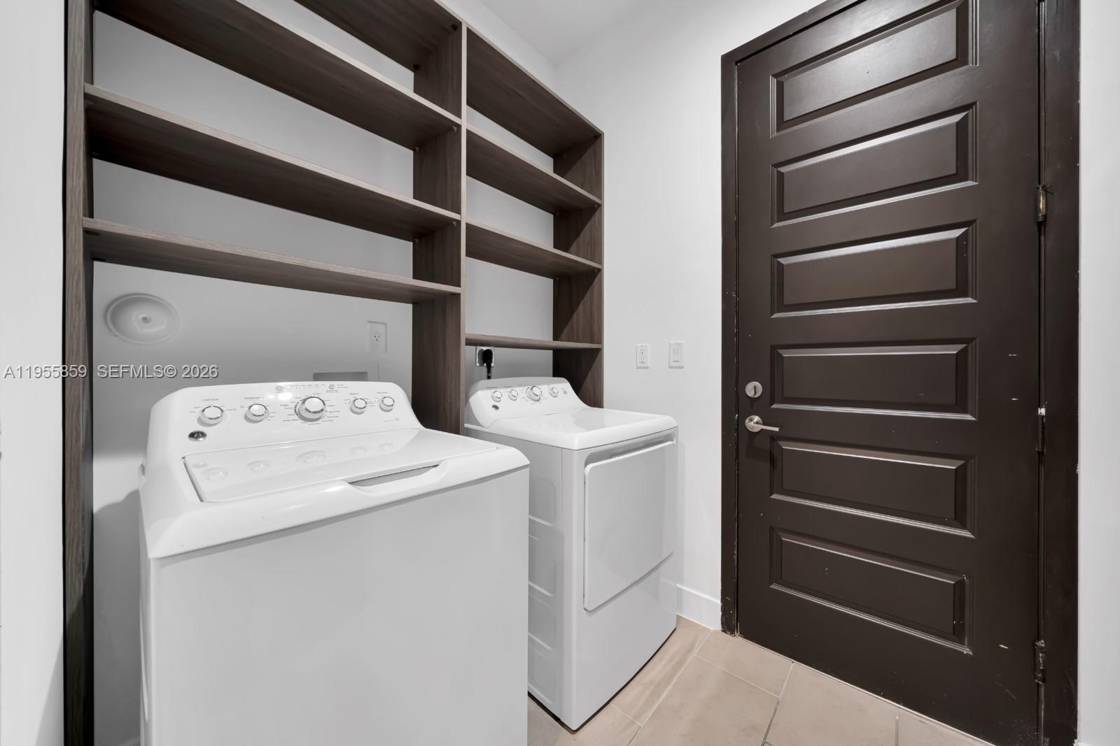 15877 Southwest 136 Way Miami, FL 33196 - Photo 10 of 18 a utility room with dryer and washer