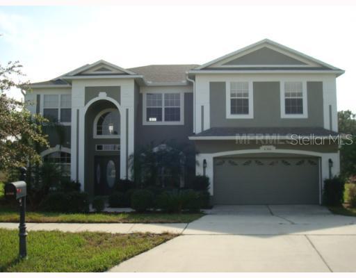 6366 Rolden Court Mount Dora, FL 32757 - Photo 1 of 1 a front view of a house with yard
