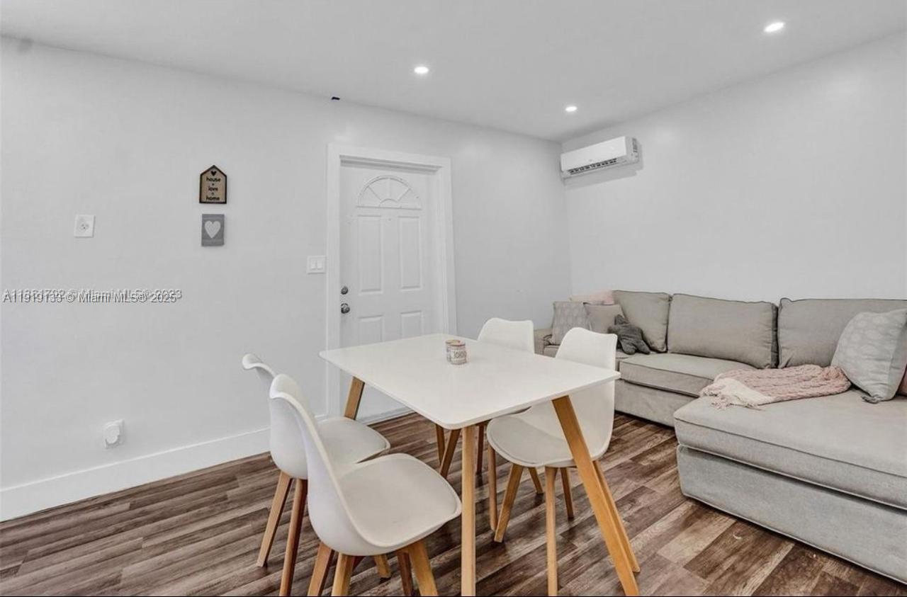 685 Southwest 7th Terrace, Unit 3 Dania Beach, FL 33004 - Photo 5 of 9 a view of a dining room with furniture