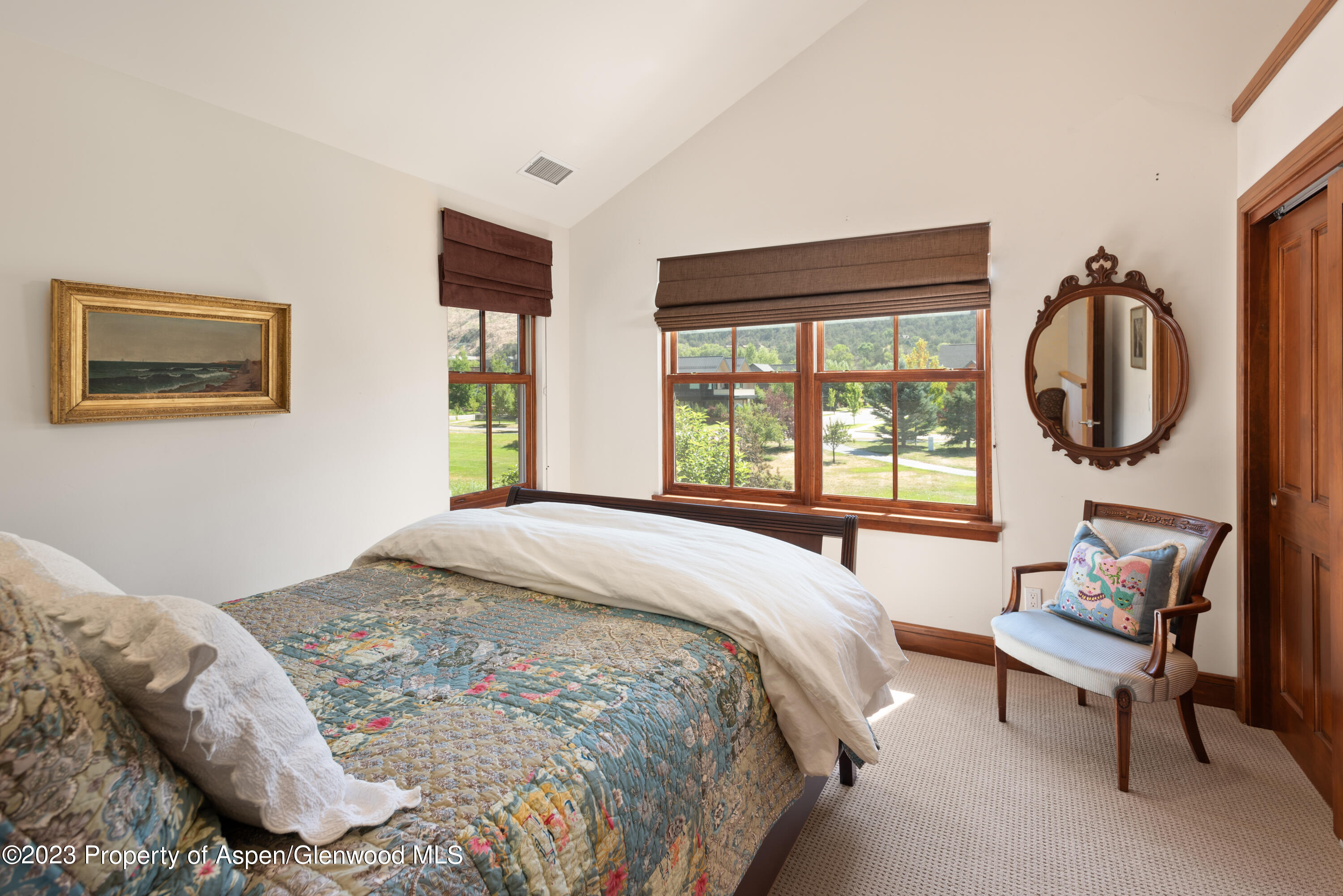 346 Sopris Circle Basalt, CO 81621 - Photo 16 of 25 a bedroom with a bed and a window